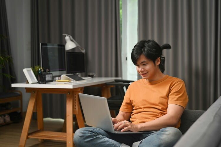 MBA applicant filling in their application at home