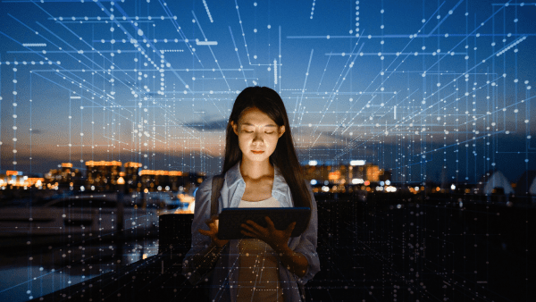 A young woman holding a tablet surrounded by virtual code lines