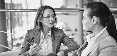 Female business school students engaged in coversation