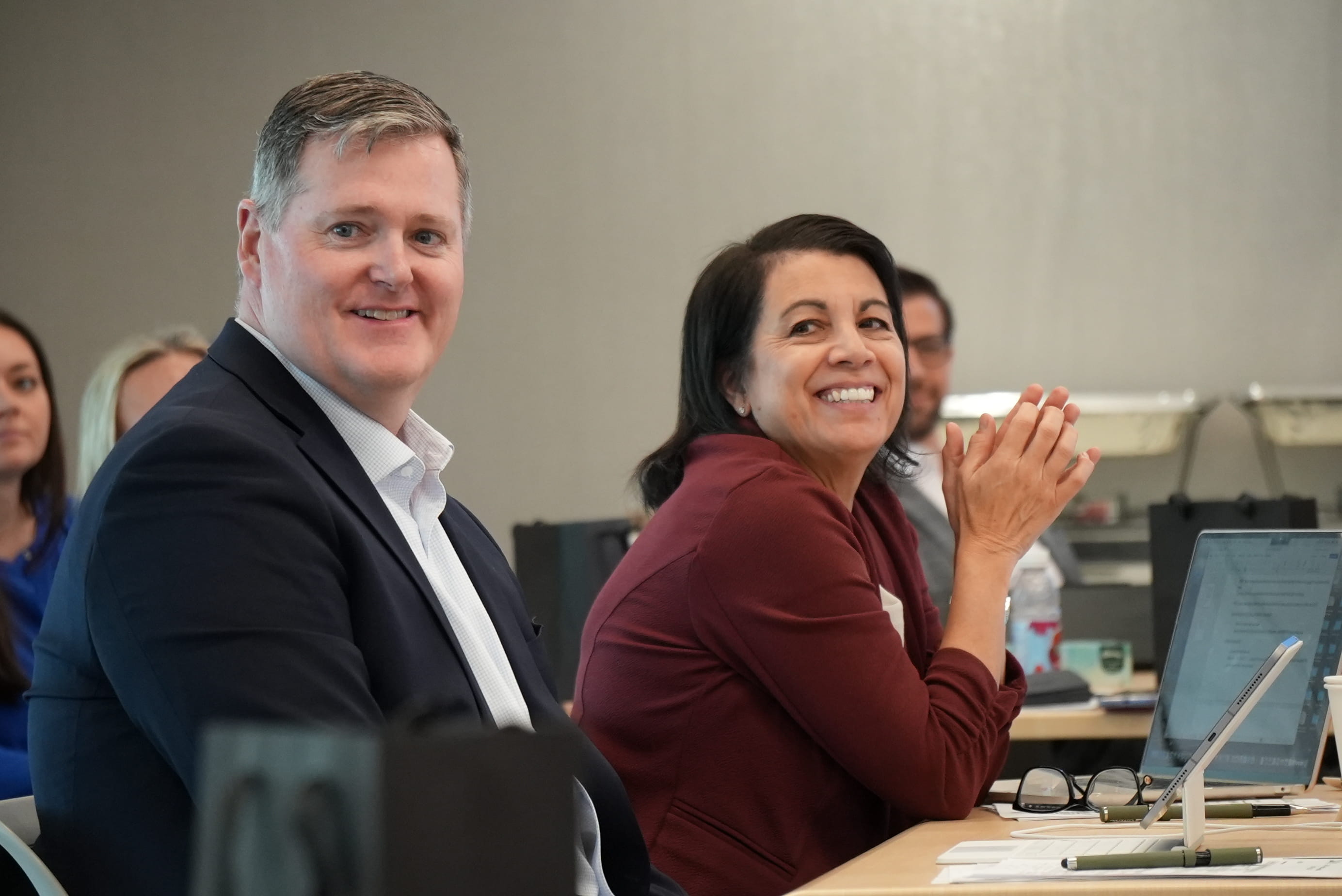 two attendees at an event in the GMAC office