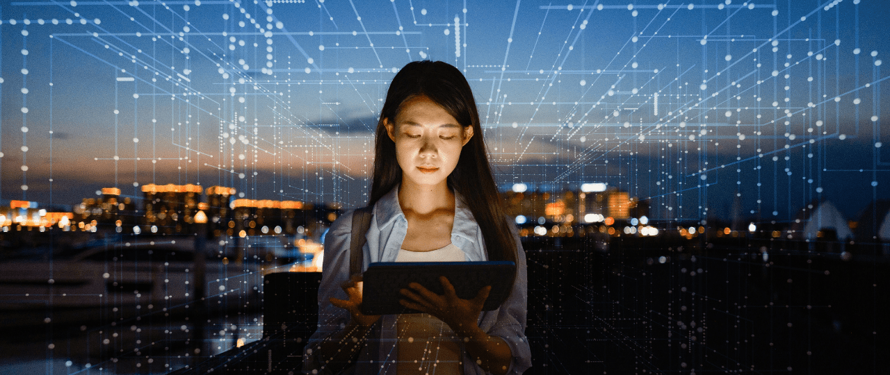 A young women holding a tablet with virtual computer lines surrounding her