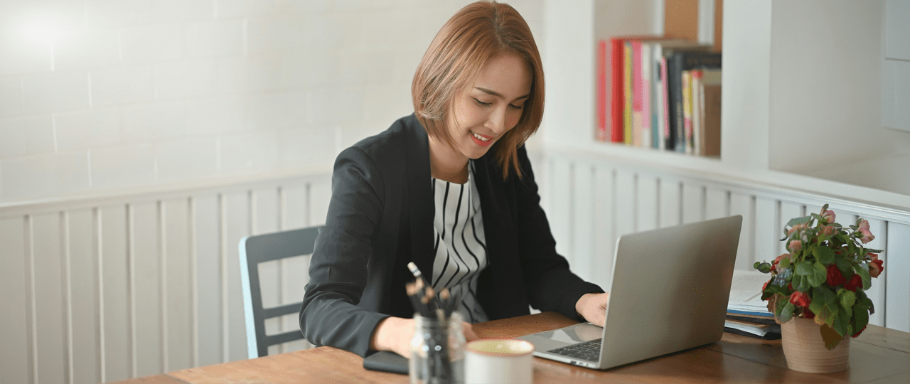 Illustration of two women drawing in a book with a pencil