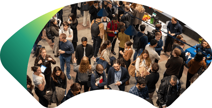A group of people interacting at a recruitment event