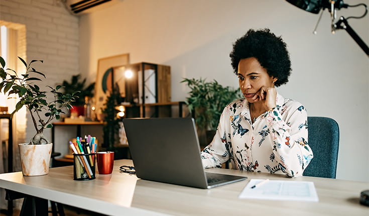 Serious Woman at Laptop 