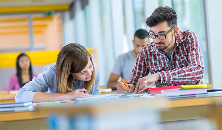 Students Studying at Work Table 