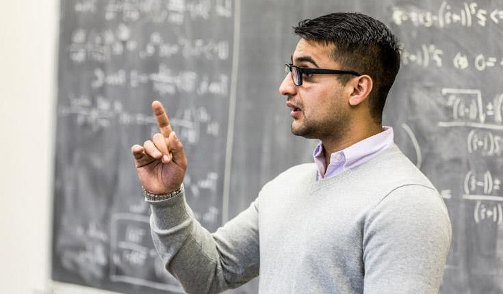 man at blackboard