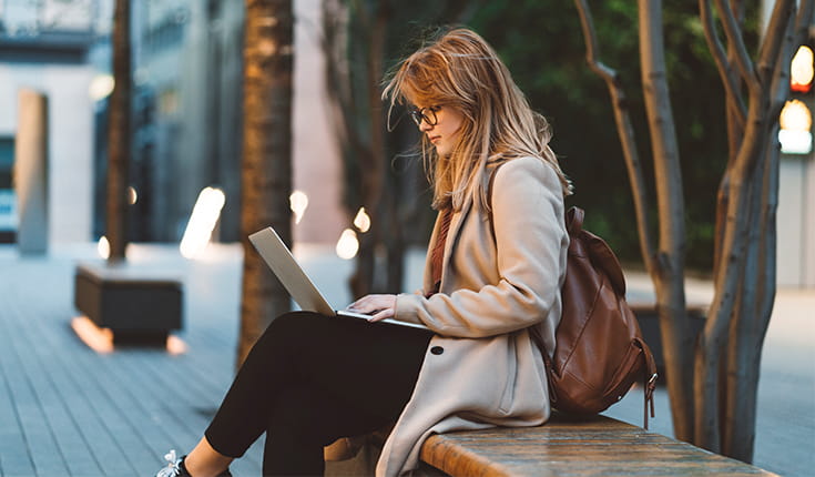 Woman on Bench with Laptop 