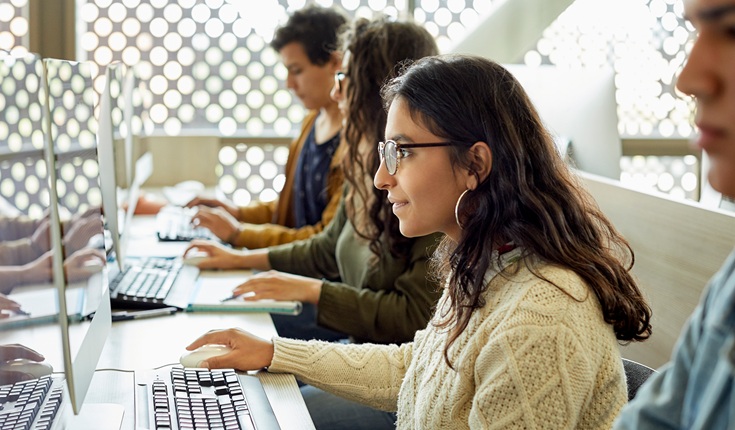 group-of-people-in-a-row-using-computers