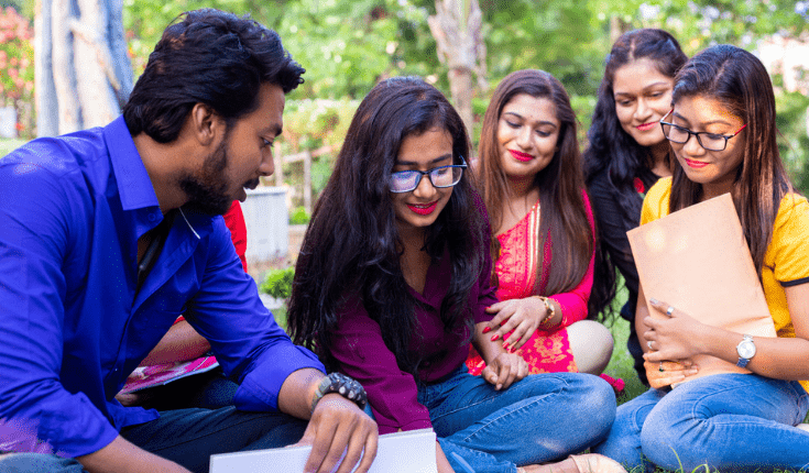Students watching kitten (out of frame)