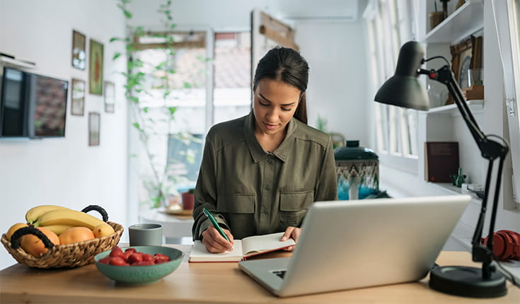 Woman Writes in Journal 