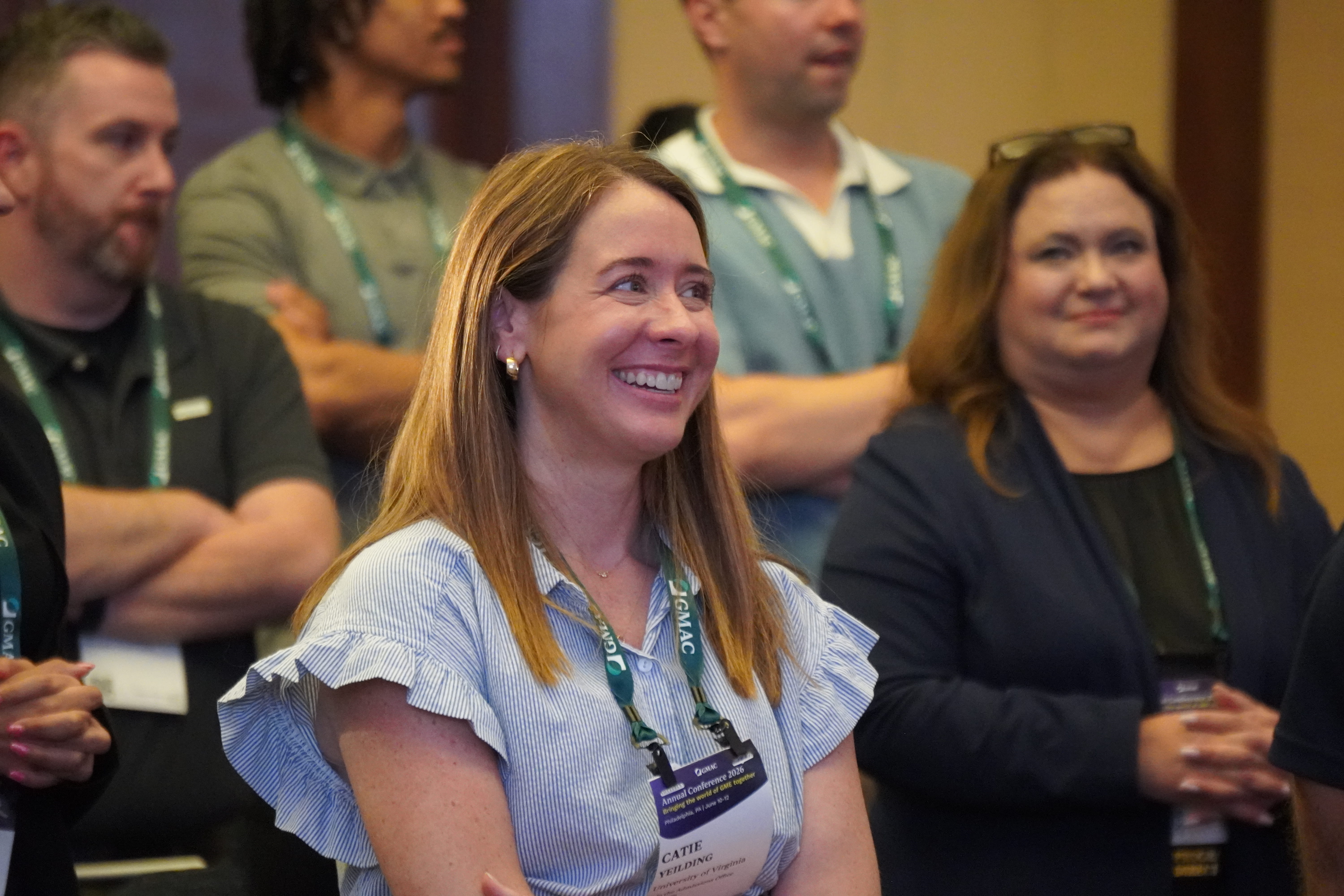 smiling woman in audience setting