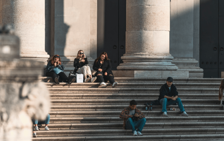Students sitting on building steps
