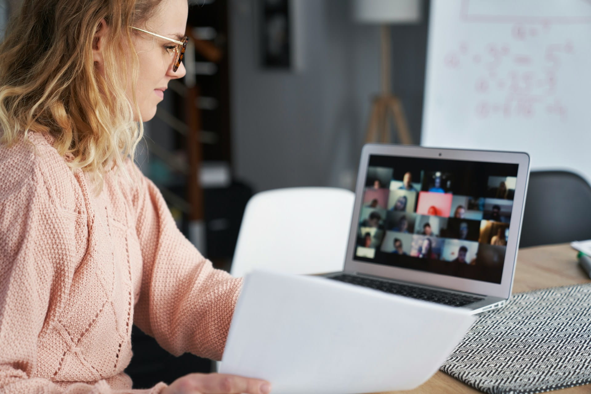 woman on a virtual webinar at desk